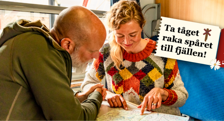 Par sitter på Snälltåget och tittar på en karta
